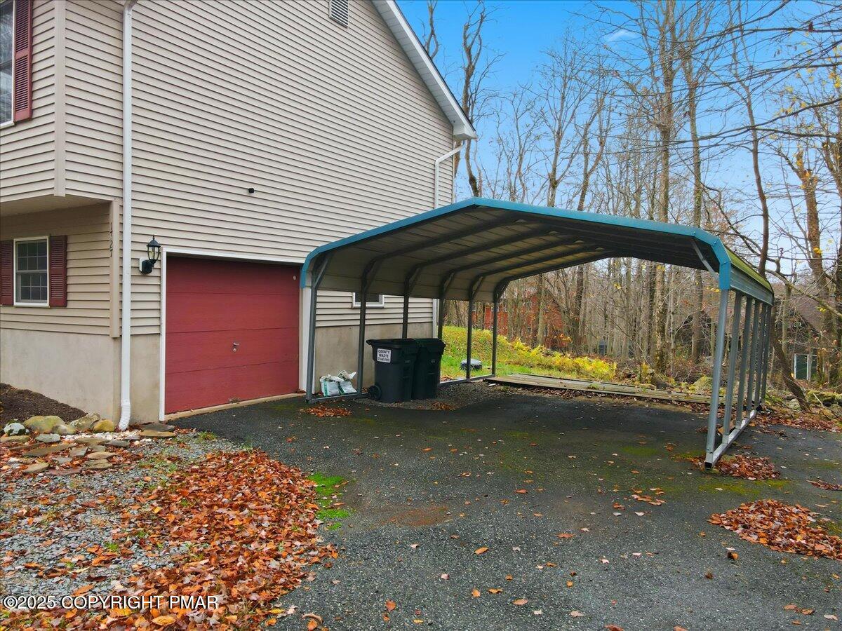 163 Long Woods Road Tobyhanna, PA 18466 - Photo 47 of 52 a view of a house with backyard and sitting area