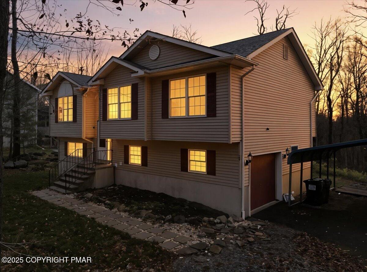 163 Long Woods Road Tobyhanna, PA 18466 - Photo 48 of 52 a front view of a house with a yard