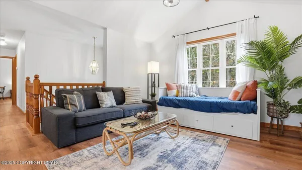 a living room with furniture and a large window