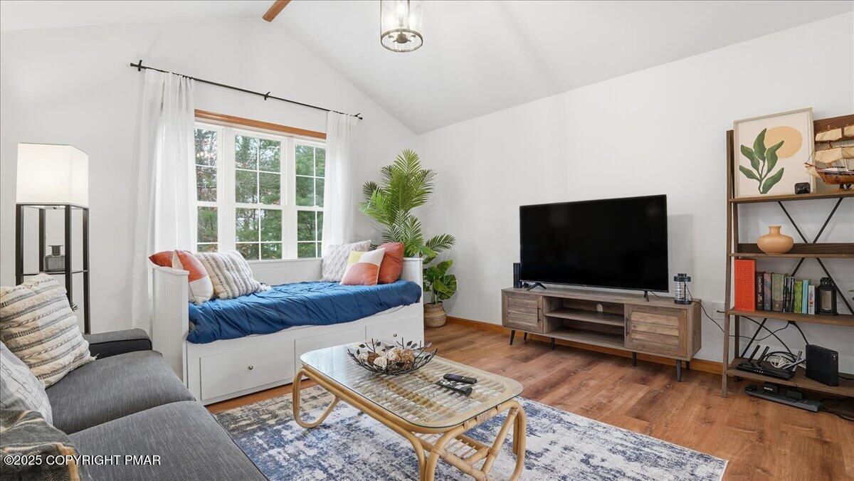 163 Long Woods Road Tobyhanna, PA 18466 - Photo 6 of 52 a living room with furniture and a flat screen tv