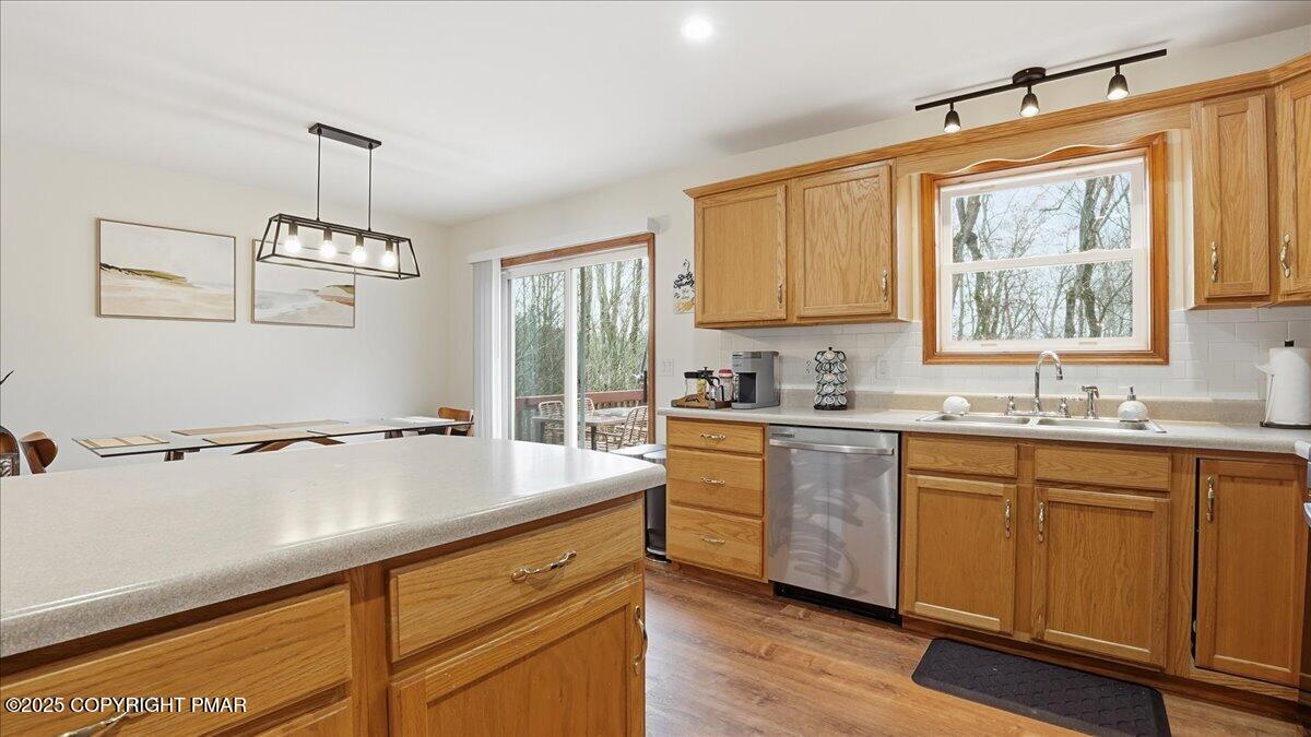 163 Long Woods Road Tobyhanna, PA 18466 - Photo 10 of 52 a kitchen with a sink appliances cabinets and a window