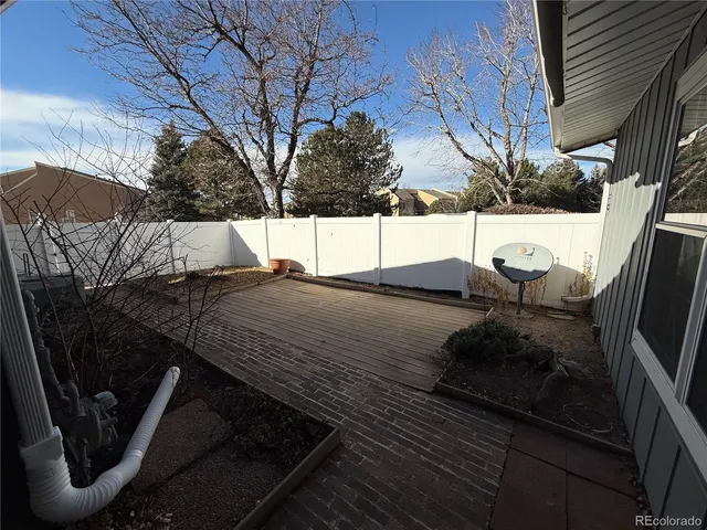a view of balcony and yard