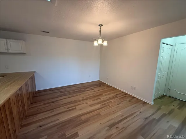 a view of a livingroom with wooden floor