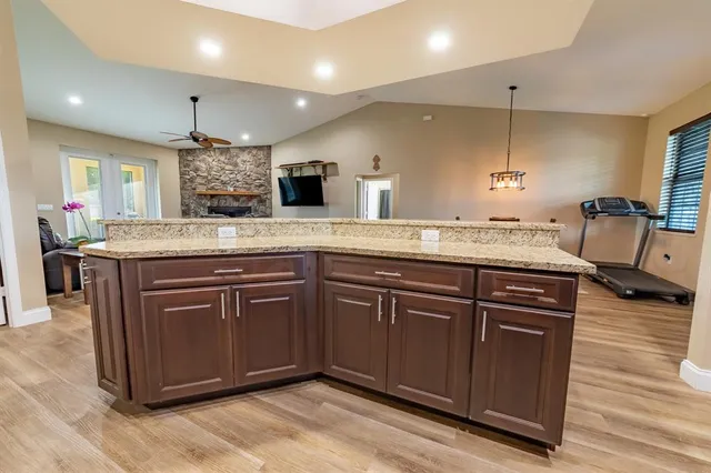 a kitchen with a sink and cabinets