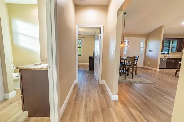 a view of a room with wooden floor