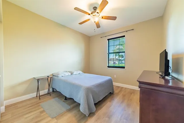 a bedroom with a bed and a desk