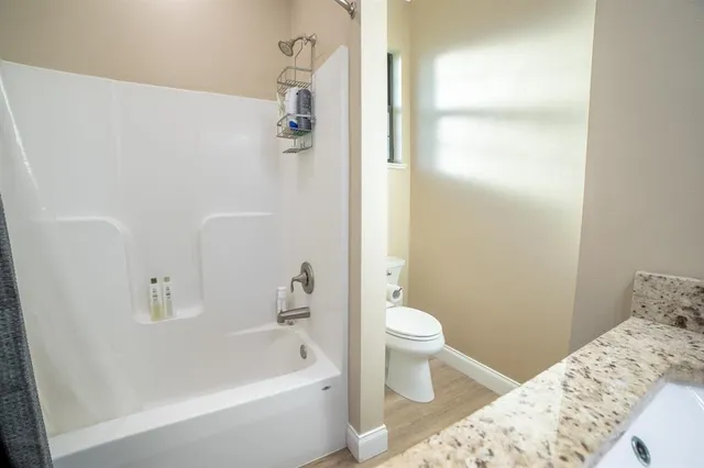 a bath room with a toilet