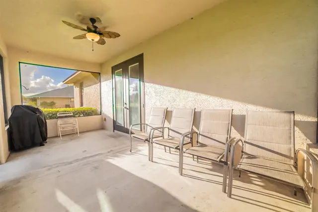 a view of a livingroom with furniture and windows