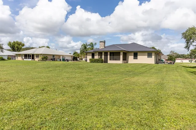 a view of a large garden with plants and large trees