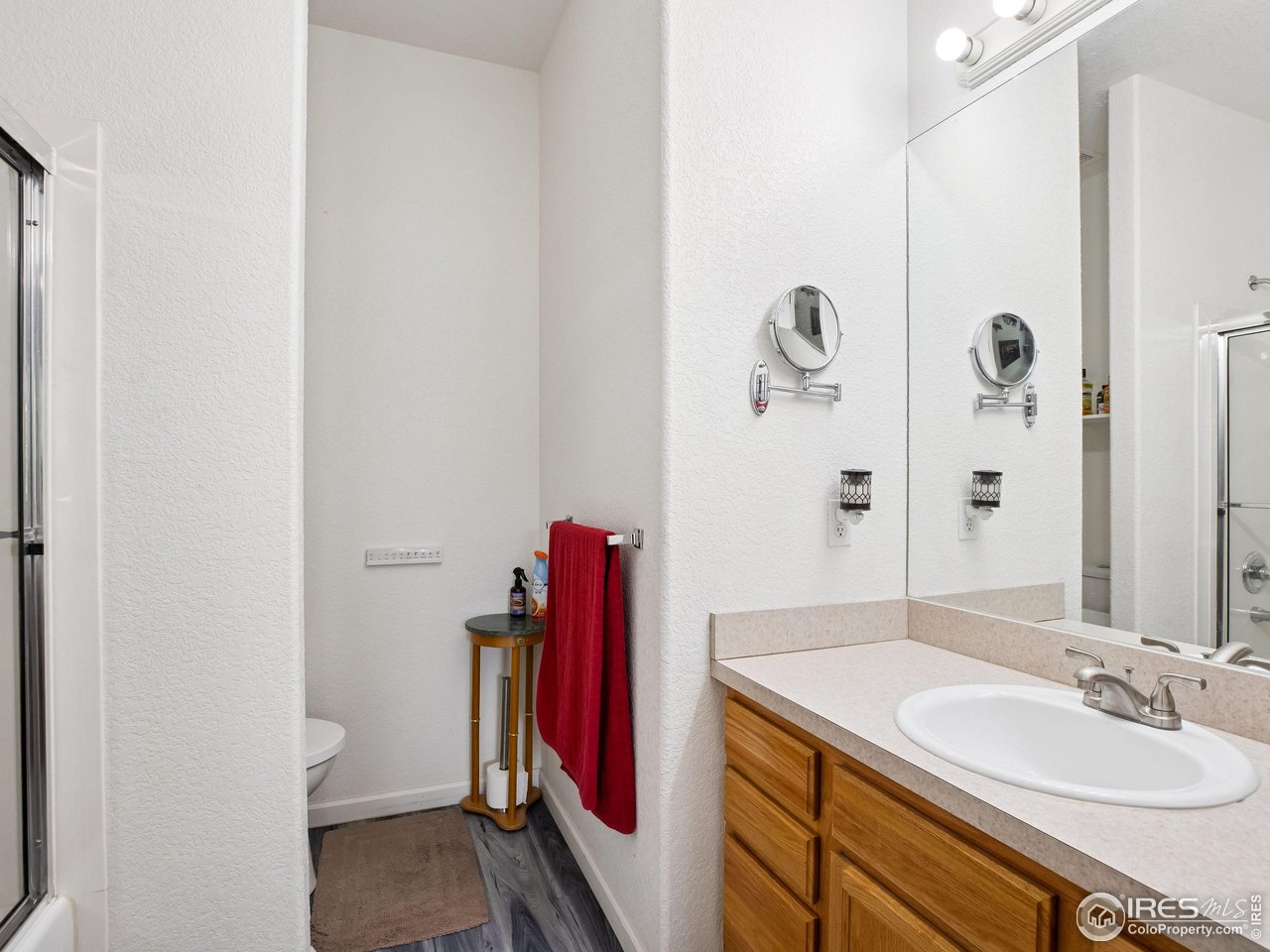 6735 West 37th Place Wheat Ridge, CO 80033 - Photo 11 of 17 a bathroom with a sink and a mirror