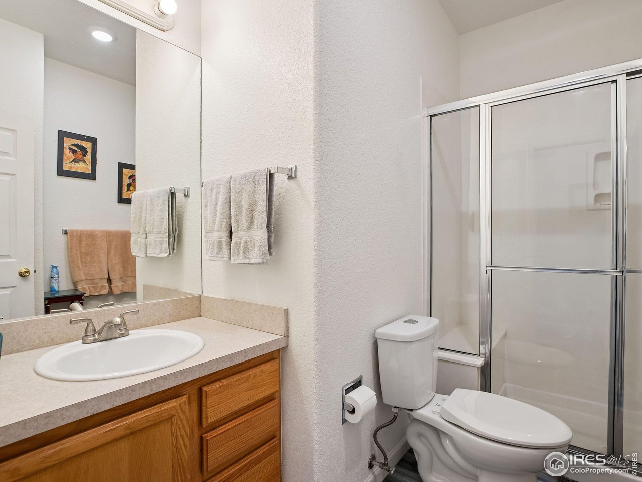 6735 West 37th Place Wheat Ridge, CO 80033 - Photo 13 of 17 a bathroom with a sink toilet and shower