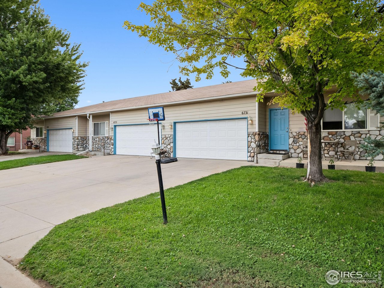 6735 West 37th Place Wheat Ridge, CO 80033 - Photo 17 of 17 a house that has a tree in front of it