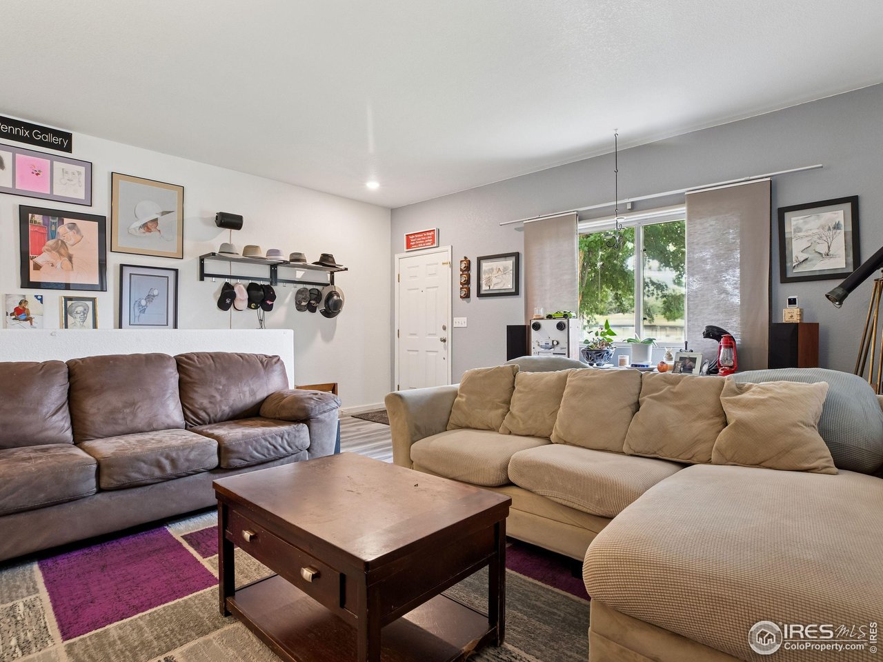 6735 West 37th Place Wheat Ridge, CO 80033 - Photo 6 of 17 a living room with furniture and a large window