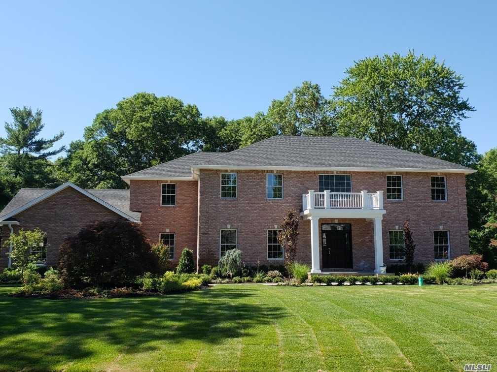 41 Cherry Lane Syosset, NY 11791 - Photo 1 of 1 a front view of a house with a yard and garage
