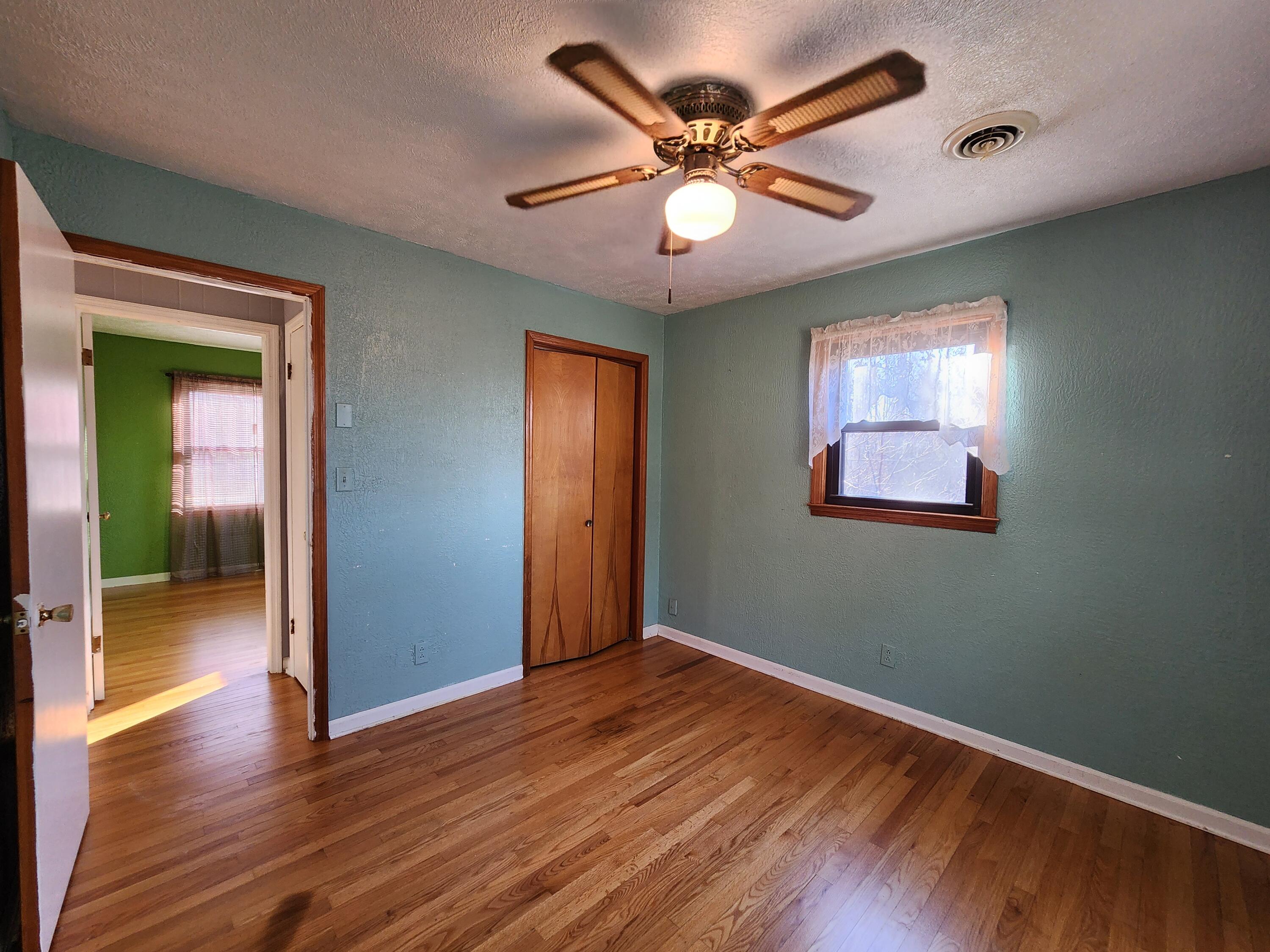 10519 Henry Road Henry, VA 24102 - Photo 18 of 25 wooden floor in an empty room with a window