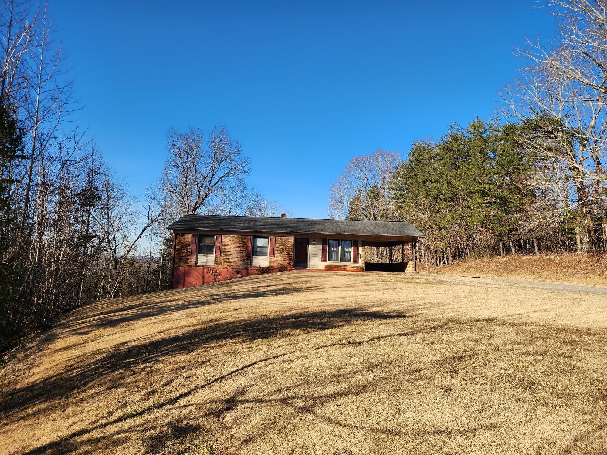 10519 Henry Road Henry, VA 24102 - Photo 2 of 25 a view of a house with a yard