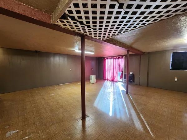 a view of a hallway with a room