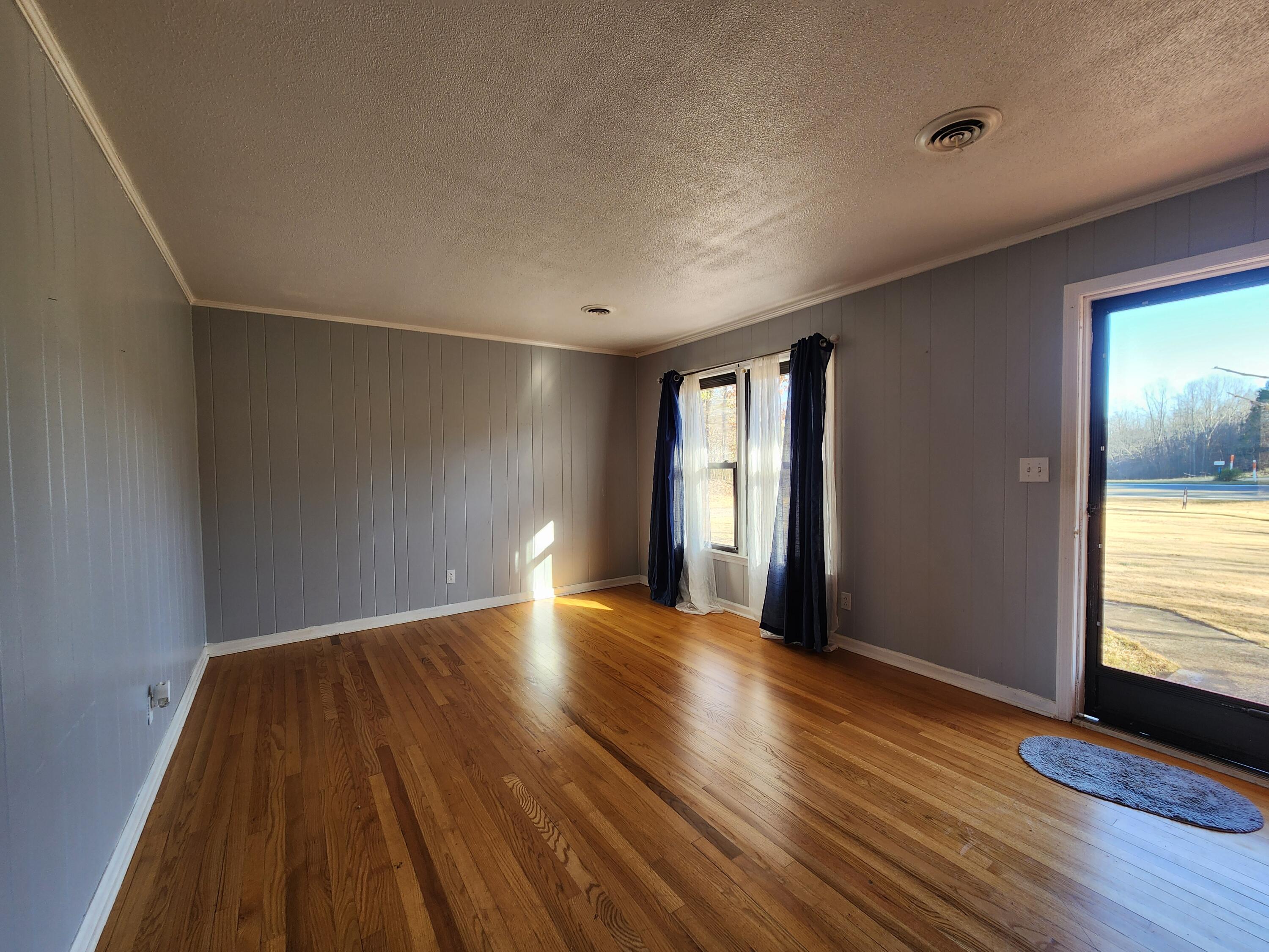 10519 Henry Road Henry, VA 24102 - Photo 7 of 25 wooden floor in an empty room with a window