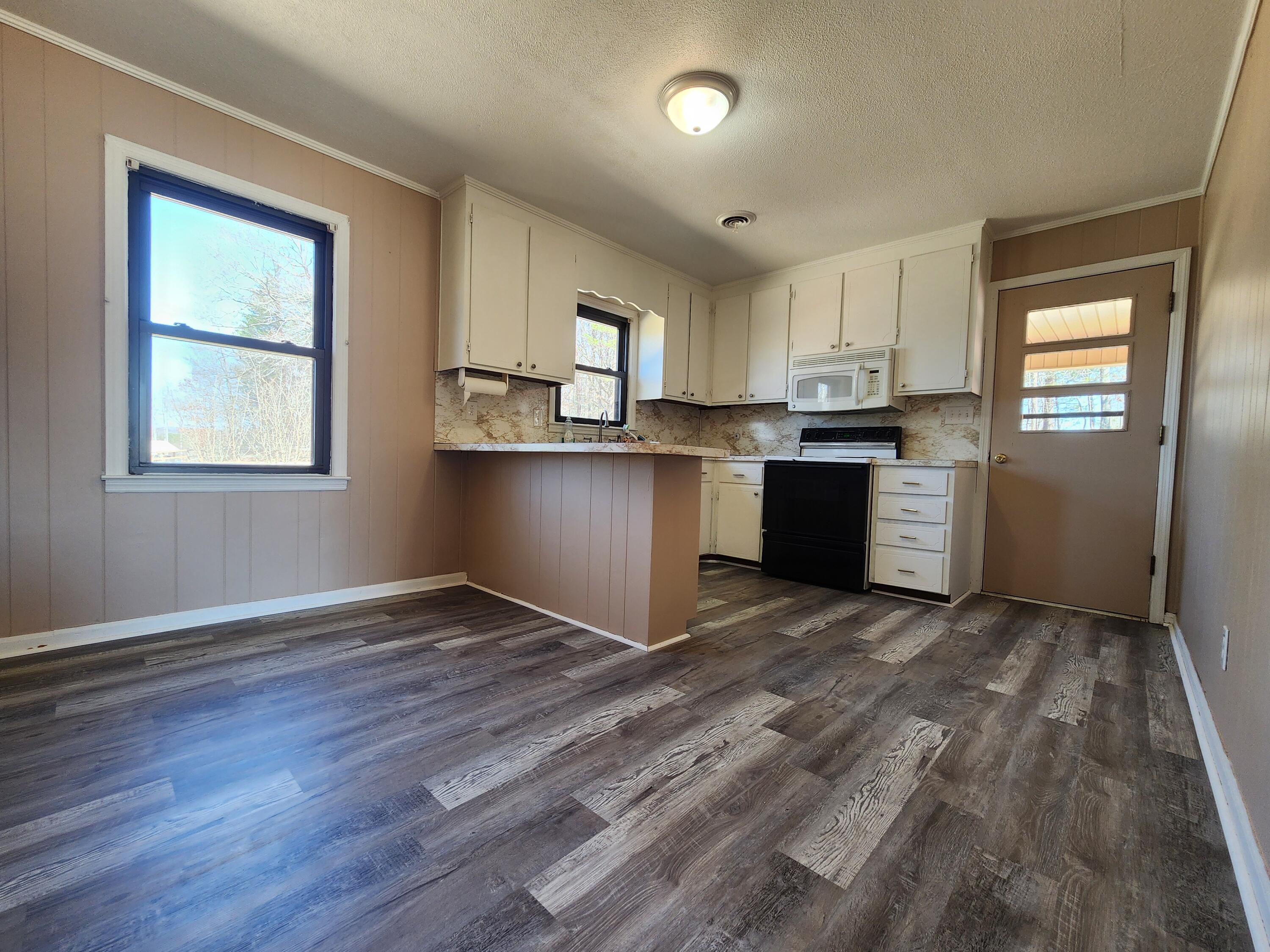 10519 Henry Road Henry, VA 24102 - Photo 9 of 25 a view of kitchen with wooden floor and electronic appliances