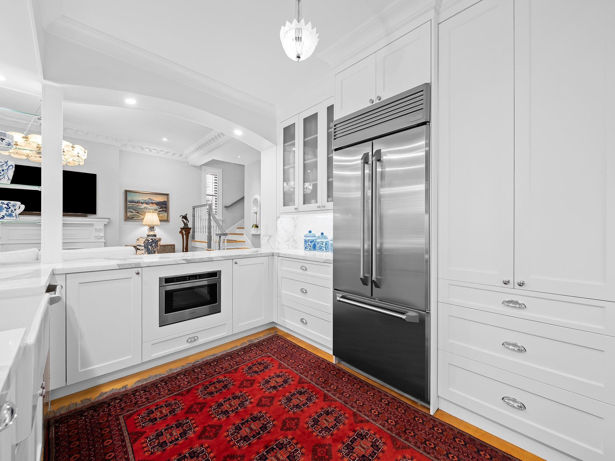 525 North Victoria Park Road Fort Lauderdale, FL 33301 - Photo 13 of 52 a kitchen with a refrigerator and white cabinets