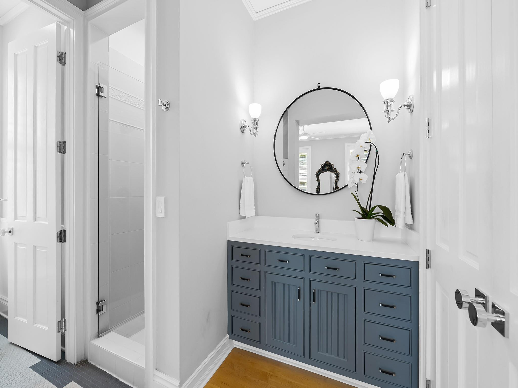 525 North Victoria Park Road Fort Lauderdale, FL 33301 - Photo 28 of 52 a bathroom with a granite countertop sink a mirror and a shower