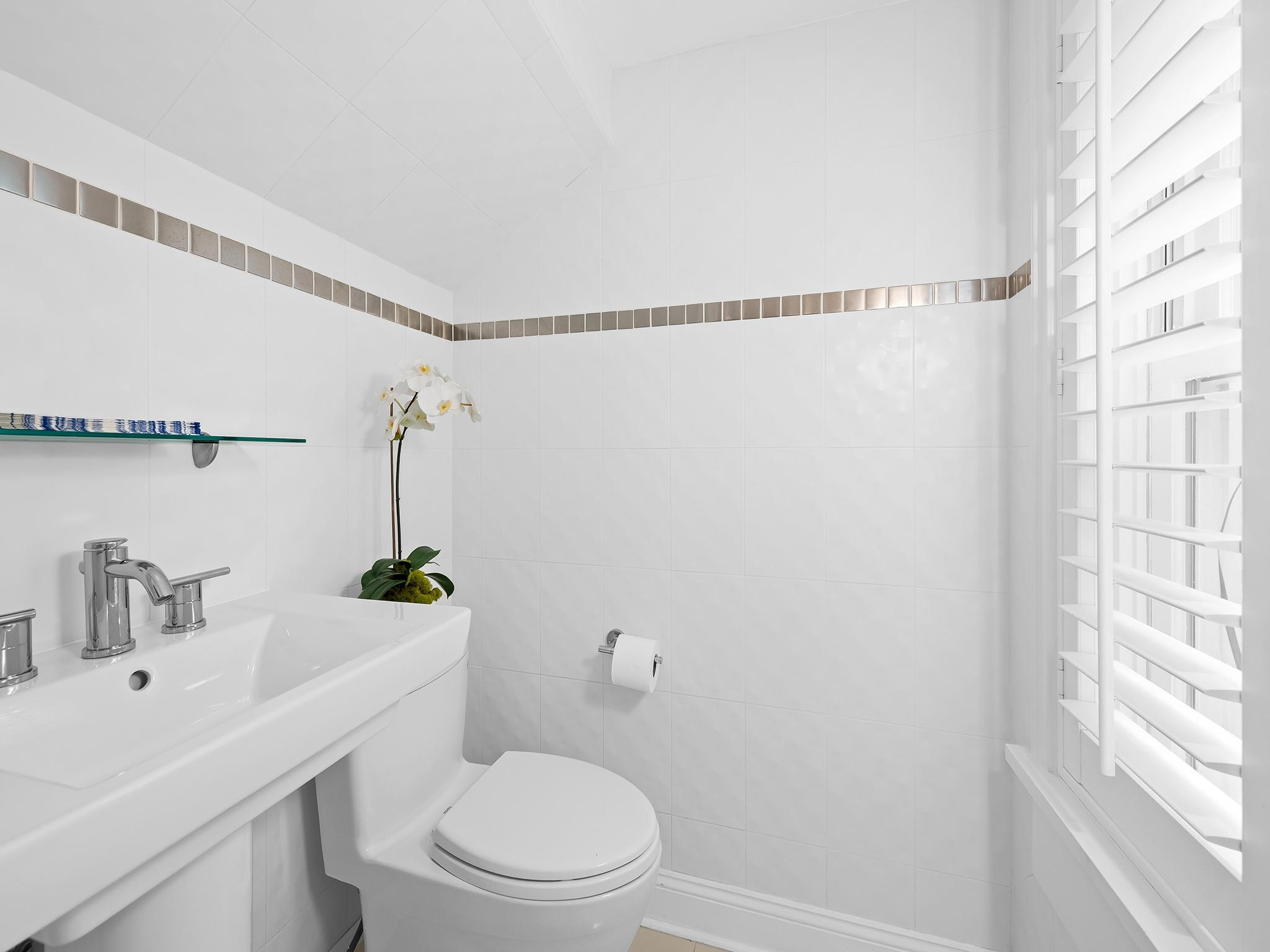 525 North Victoria Park Road Fort Lauderdale, FL 33301 - Photo 48 of 52 a bathroom with a toilet a sink and shower