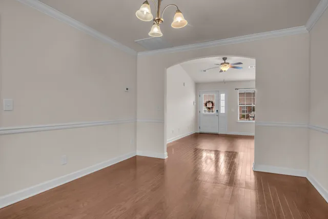 a kitchen with stainless steel appliances granite countertop wooden cabinets and a stove top oven