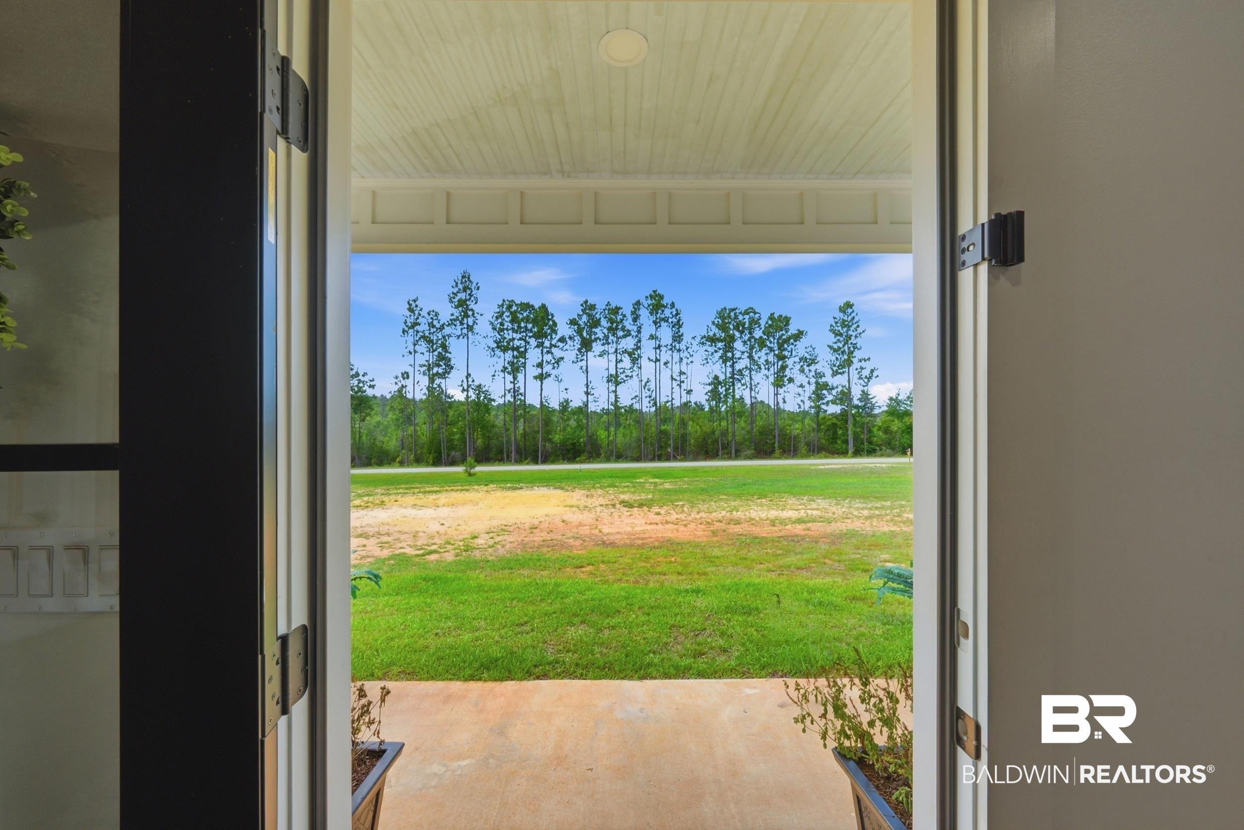 12019 Red Hill Rd Extension Bay Minette, AL 36507 - Photo 36 of 48 Expansive front porch providing a direct exterior perspective
