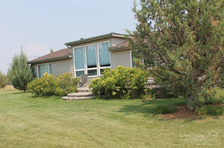 13562 Southeast Cayuse Road Prineville, OR 97754 - Photo 8 of 21 Paver patio and large windows. westside