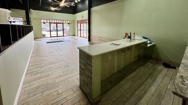 a bathroom with a sink mirror and window