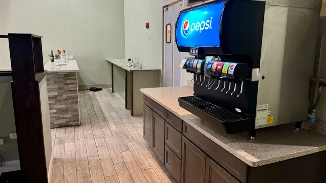 a kitchen with stainless steel appliances granite countertop a stove and a refrigerator