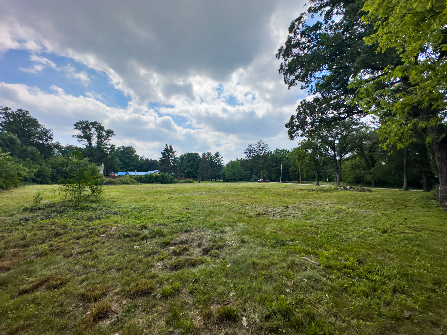 8950 Wolf Road Burr Ridge, IL 60527 - Photo 8 of 8 a view of a green field with wooden fence