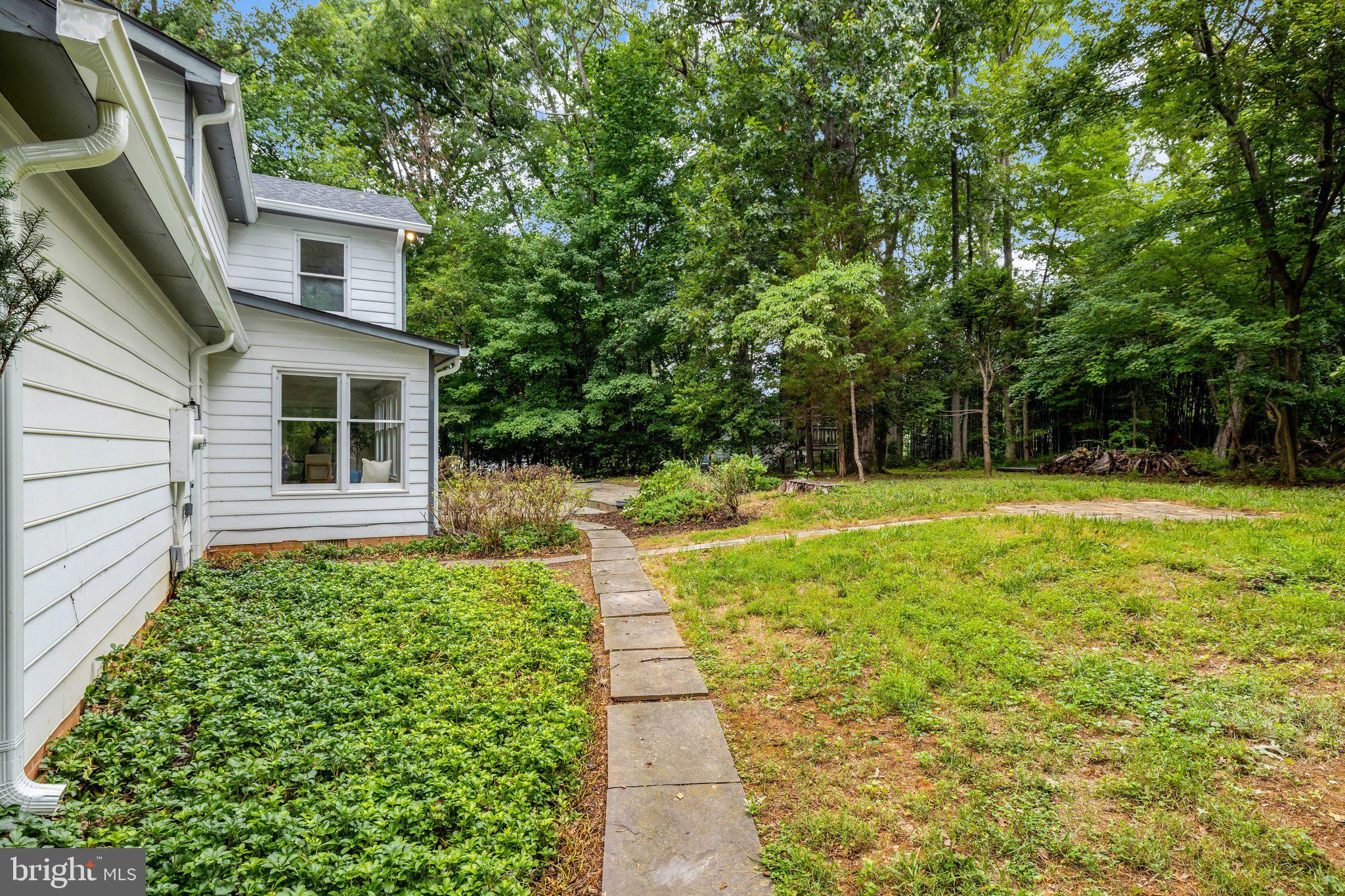 1132 Springvale Road Great Falls, VA 22066 - Photo 65 of 81 Serene garden path in lush greenery.