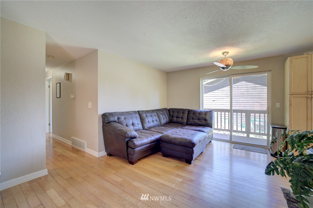 1 172nd Place Southwest Bothell, WA 98012 - Photo 12 of 27 a living room with furniture and a large window