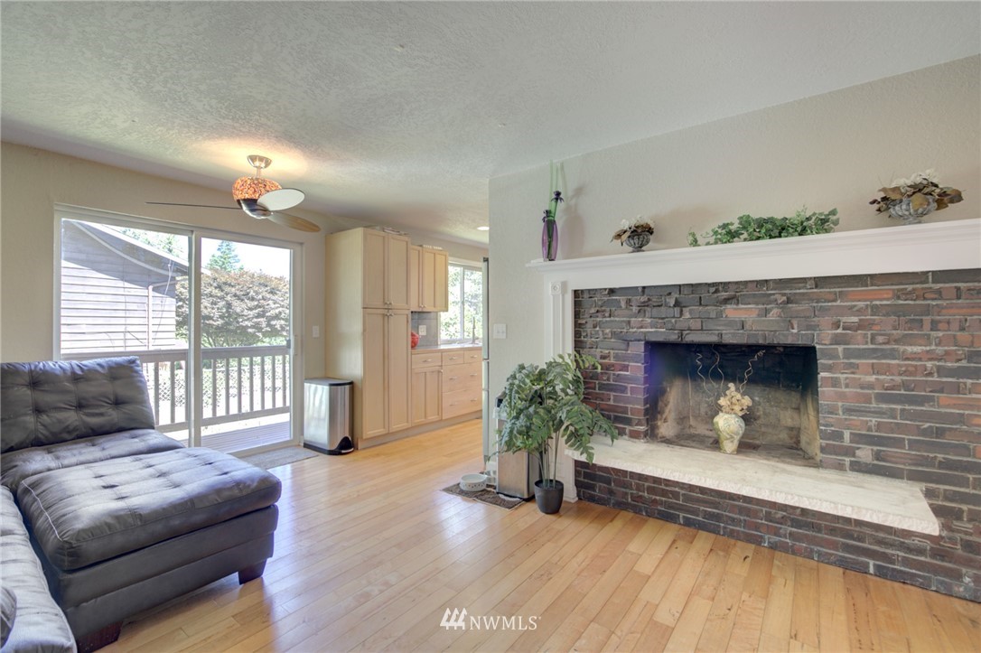 1 172nd Place Southwest Bothell, WA 98012 - Photo 13 of 27 a living room with furniture and a fireplace