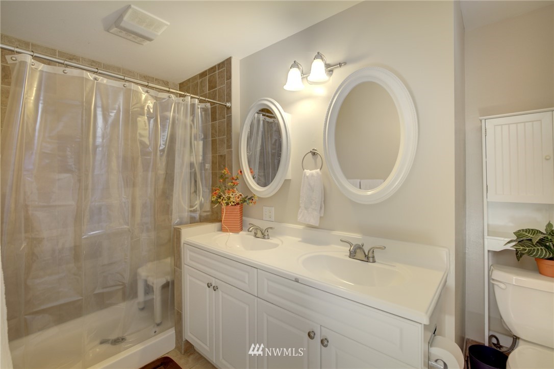 1 172nd Place Southwest Bothell, WA 98012 - Photo 16 of 27 a bathroom with a sink and a mirror