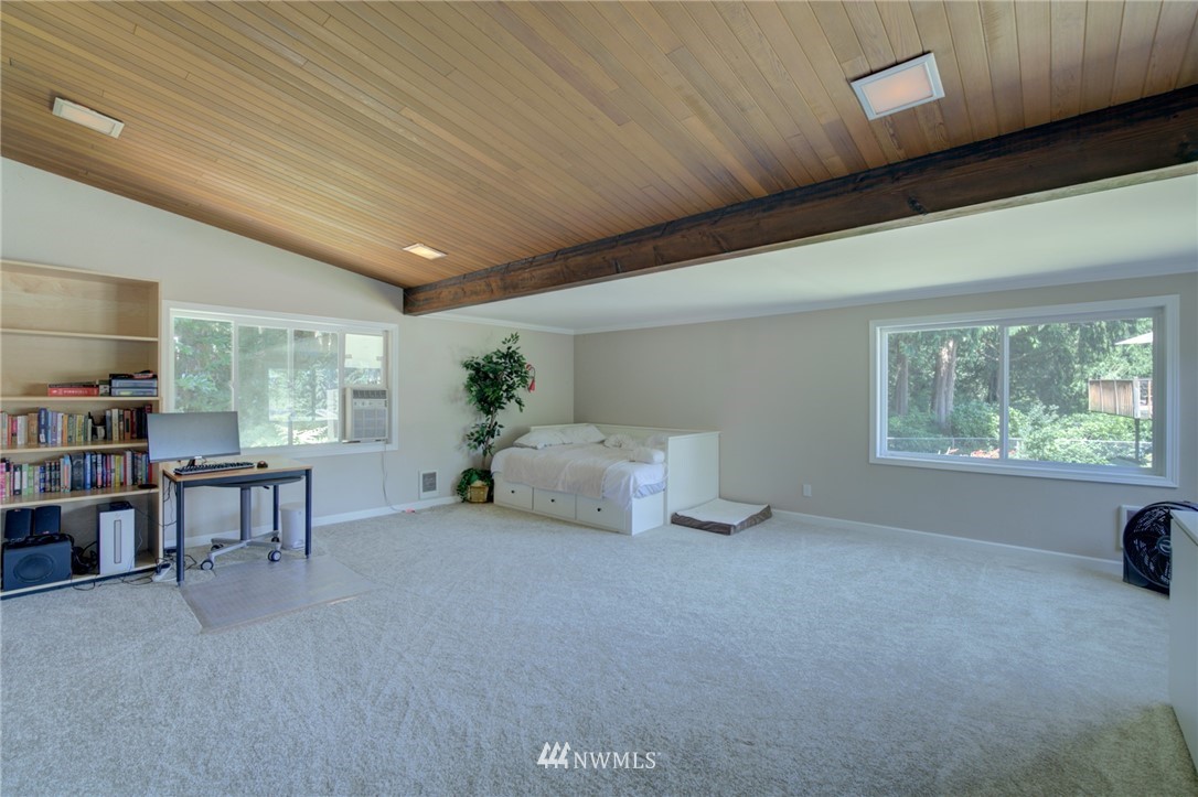 1 172nd Place Southwest Bothell, WA 98012 - Photo 19 of 27 a living room with furniture and a large window