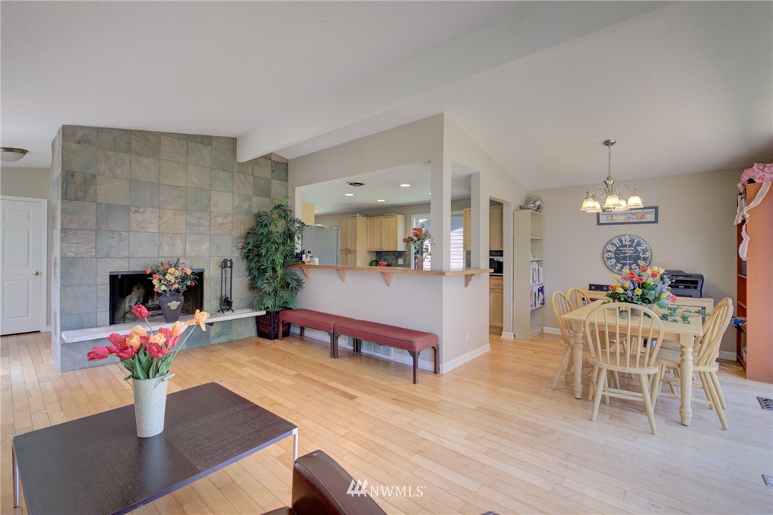 1 172nd Place Southwest Bothell, WA 98012 - Photo 3 of 27 a living room with furniture and a fireplace