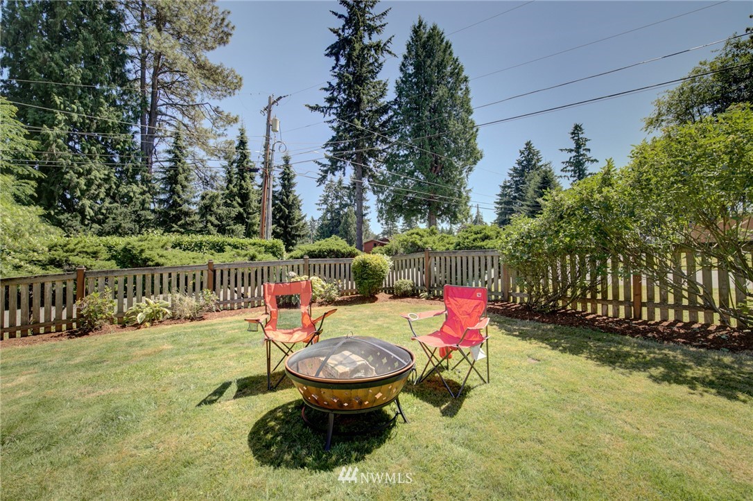 1 172nd Place Southwest Bothell, WA 98012 - Photo 21 of 27 a wooden bench sitting in the middle of a yard