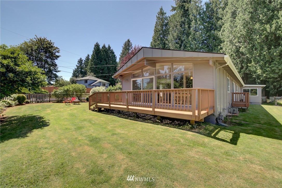 1 172nd Place Southwest Bothell, WA 98012 - Photo 24 of 27 a front view of house with yard and trees in the background