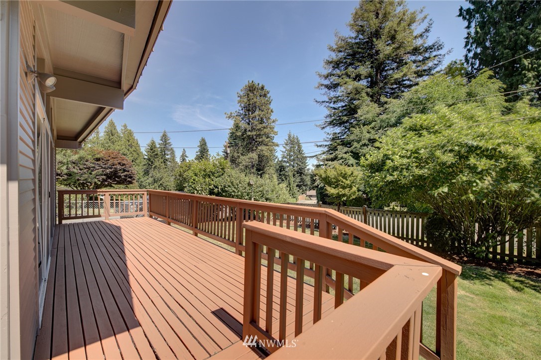 1 172nd Place Southwest Bothell, WA 98012 - Photo 25 of 27 a view of balcony with wooden floor and outdoor space