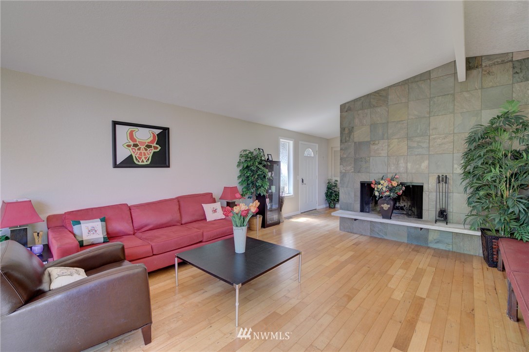 1 172nd Place Southwest Bothell, WA 98012 - Photo 4 of 27 a living room with furniture and a fireplace