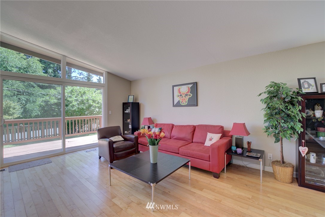 1 172nd Place Southwest Bothell, WA 98012 - Photo 5 of 27 a living room with furniture and a large window