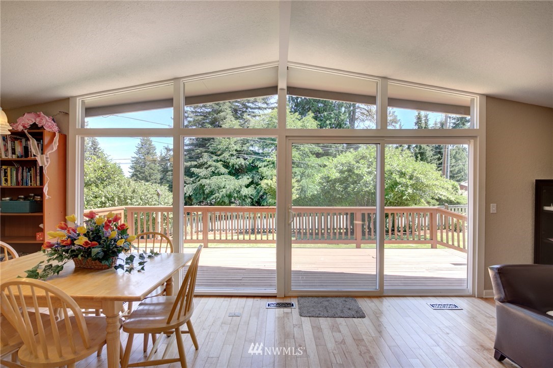 1 172nd Place Southwest Bothell, WA 98012 - Photo 8 of 27 a view of a dining room with furniture window and wooden floor