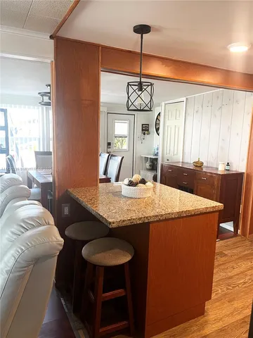 a dining table with chairs and window