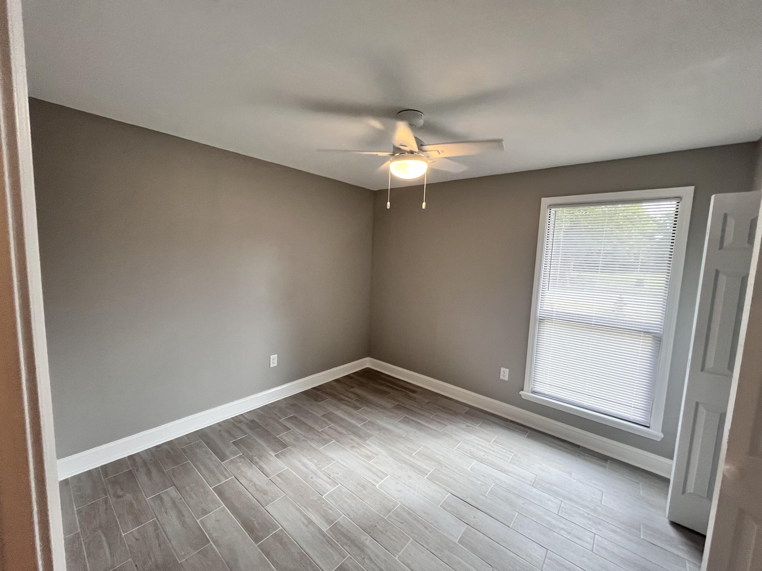 795 Bay Street Crestview, FL 32536 - Photo 15 of 16 an empty room with a window