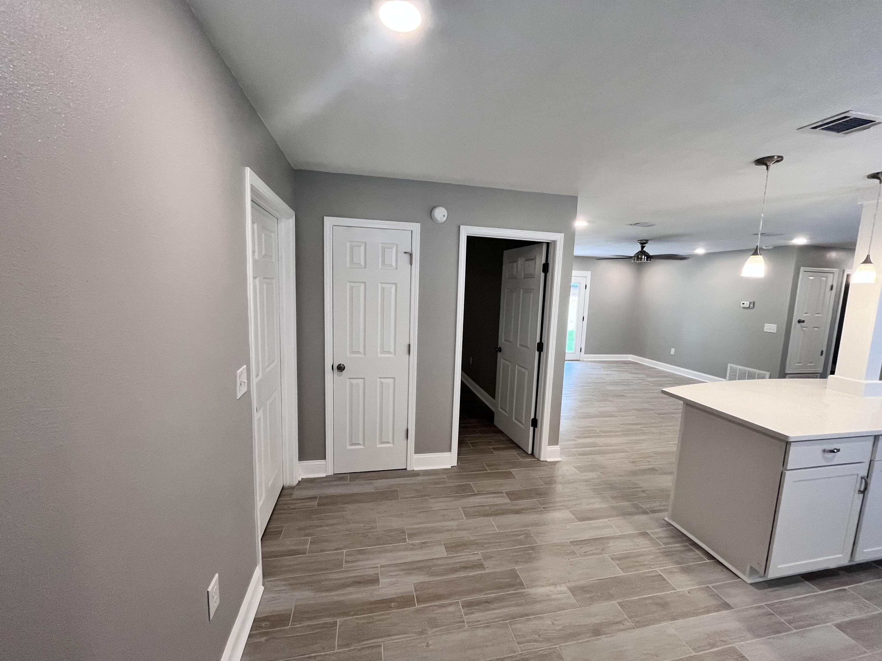 795 Bay Street Crestview, FL 32536 - Photo 2 of 16 a view of a bathroom with a sink and a mirror