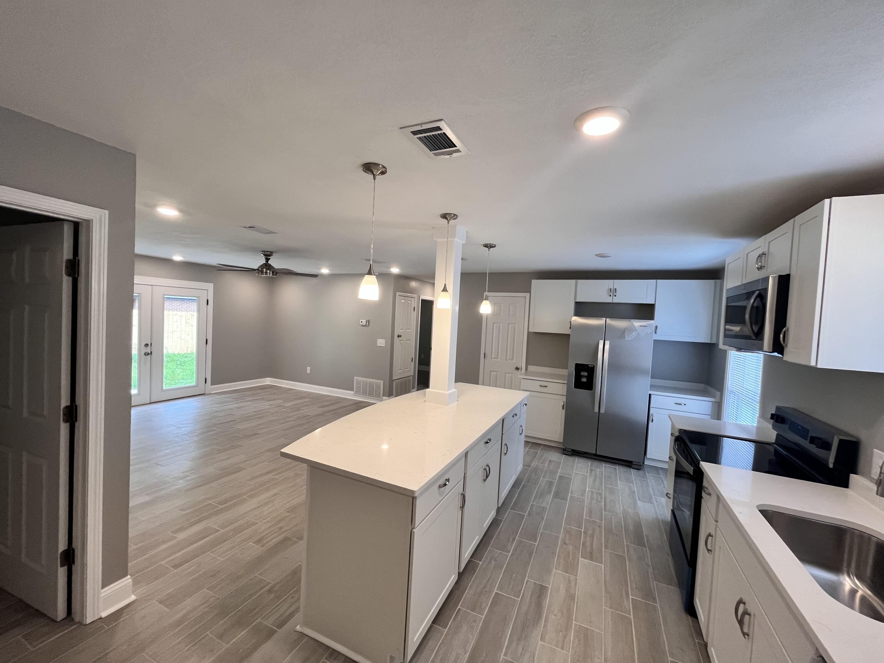 795 Bay Street Crestview, FL 32536 - Photo 4 of 16 a large kitchen with a lot of counter space