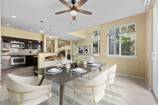 a kitchen with a dining table and chairs