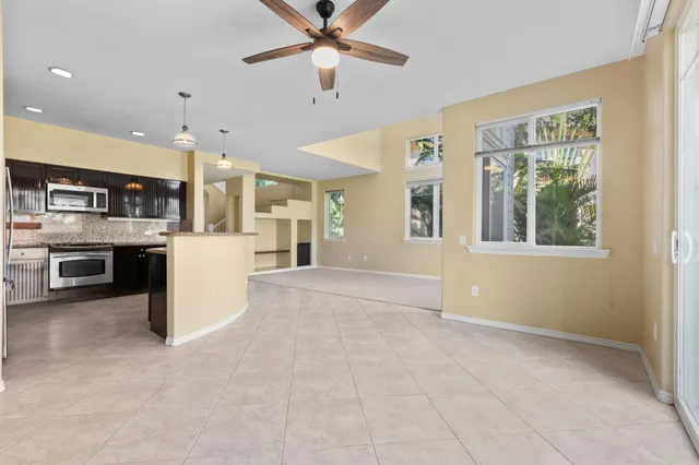a view of a kitchen with a sink and a window